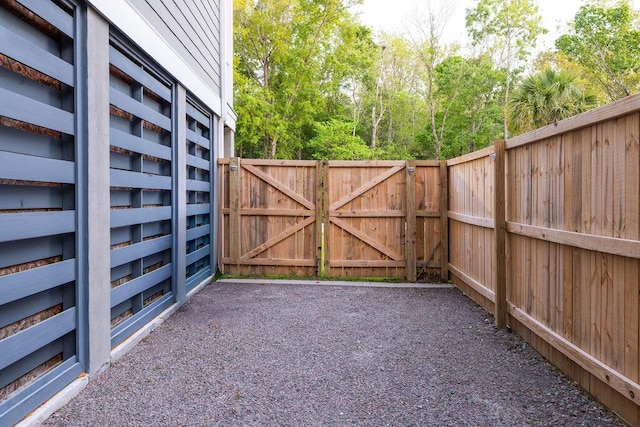 view of gate featuring fence