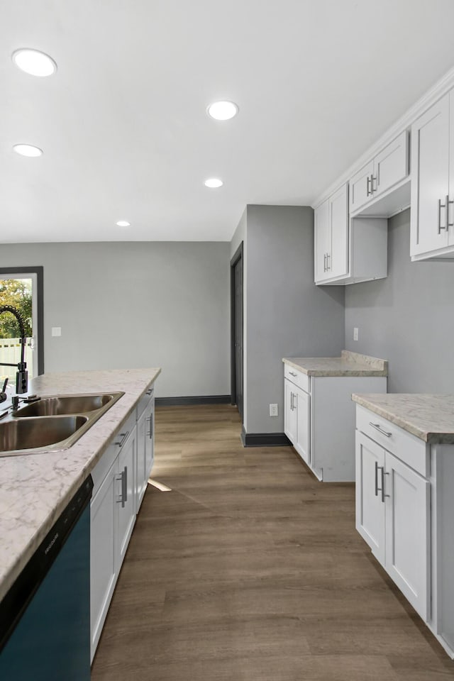 kitchen featuring sink and white cabinets