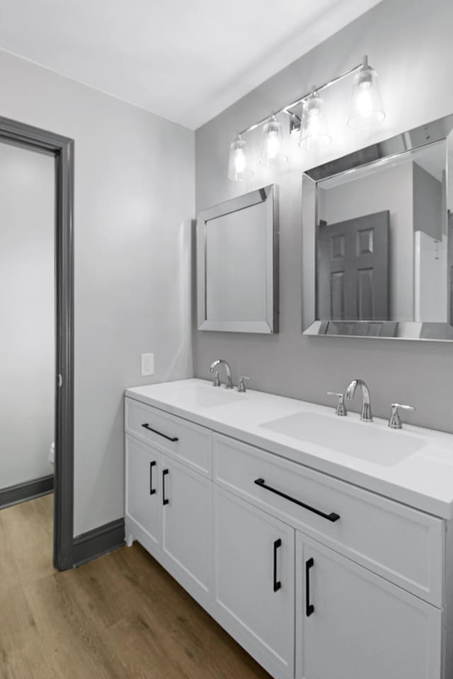 bathroom featuring vanity and hardwood / wood-style flooring