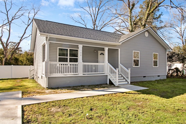 view of front of home featuring covered porch and a front lawn