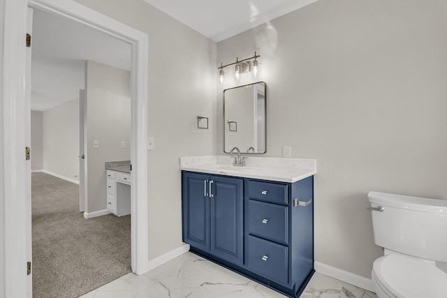 bathroom featuring toilet, marble finish floor, baseboards, and vanity