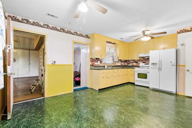109 Rahway Rd, Goose Creek, SC 29445 - kitchen featuring white appliances, a ceiling fan, under cabinet range hood, dark countertops, and dark floors