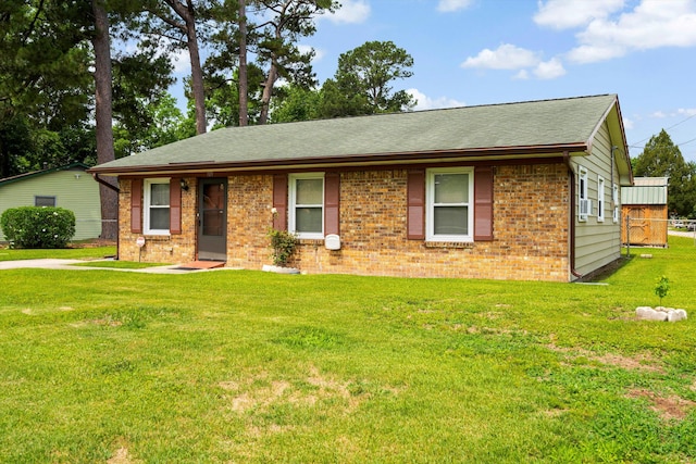 109 Rahway Rd, Goose Creek, SC 29445 - view of front of home with brick siding, a front yard, and roof with shingles