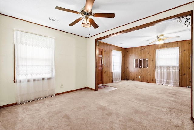 109 Rahway Rd, Goose Creek, SC 29445 - unfurnished room featuring ceiling fan, healthy amount of natural light, wooden walls, carpet flooring, and ornamental molding