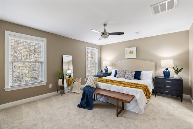 bedroom featuring ceiling fan and light colored carpet