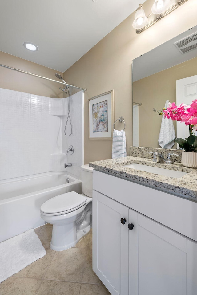 full bathroom with vanity, tub / shower combination, tile patterned floors, and toilet