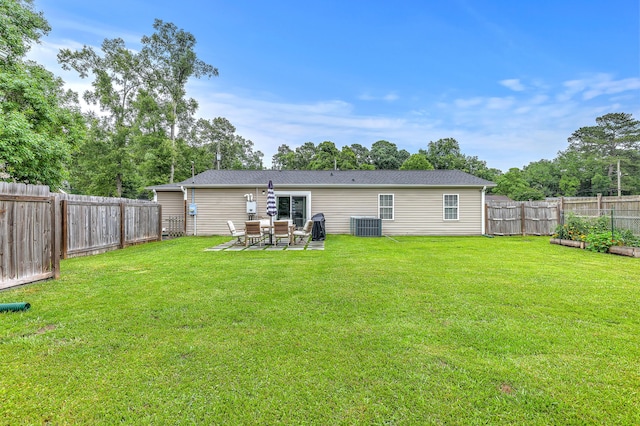 337 Price St, Goose Creek, SC 29445 - back of property with central AC, a patio, and a vegetable garden