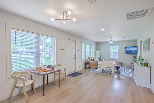 337 Price St, Goose Creek, SC 29445 - foyer entrance with a chandelier, light wood-type flooring, and baseboards