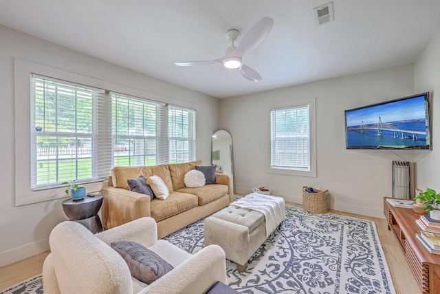 337 Price St, Goose Creek, SC 29445 - living room featuring baseboards, wood finished floors, and a ceiling fan