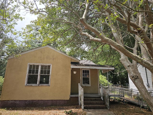 view of front of house featuring stucco siding