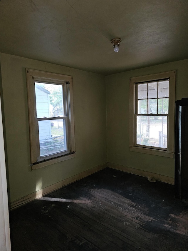 2313 Aintree Ave, North Charleston, SC 29405 - empty room featuring a wealth of natural light, dark wood-type flooring, and baseboards