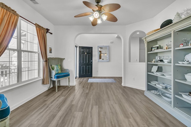 entryway with ceiling fan and light wood-type flooring