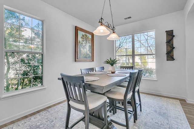 dining area with wood-type flooring