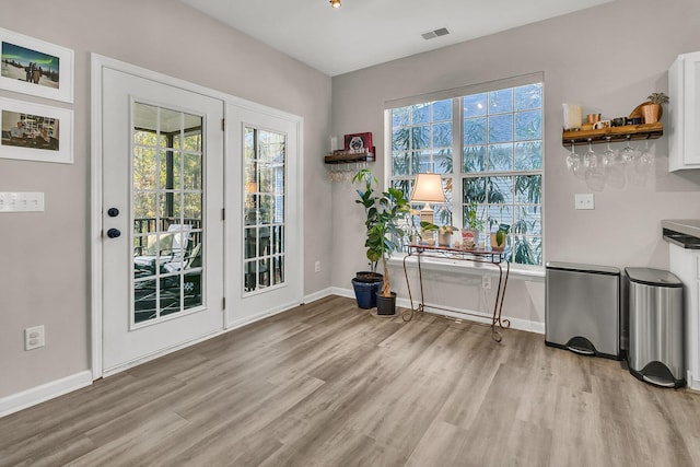 doorway to outside featuring light hardwood / wood-style flooring