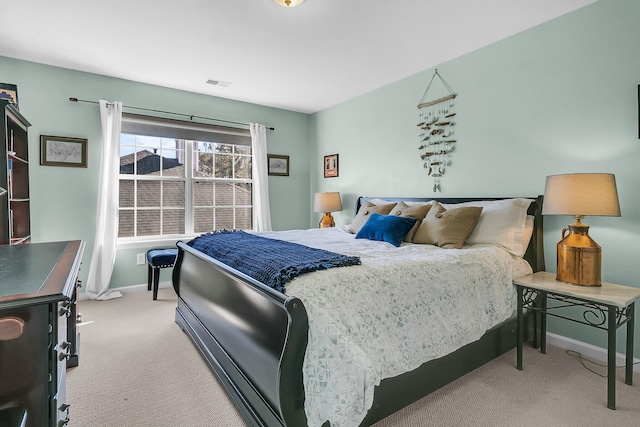 bedroom with light colored carpet