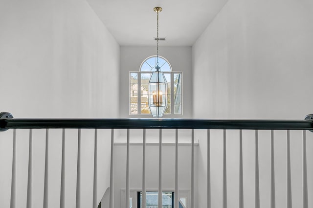 interior details featuring a notable chandelier