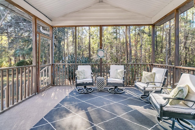 sunroom / solarium with vaulted ceiling and a wealth of natural light