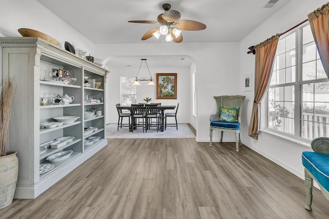 interior space featuring hardwood / wood-style floors and ceiling fan