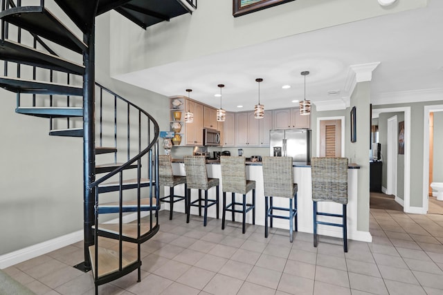 9002 Palmetto Dr Unit 512, Isle Of Palms, SC 29451 - kitchen featuring stainless steel appliances, recessed lighting, a breakfast bar area, a peninsula, and baseboards