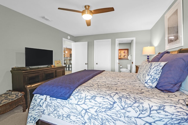 bedroom with carpet floors, connected bathroom, and ceiling fan