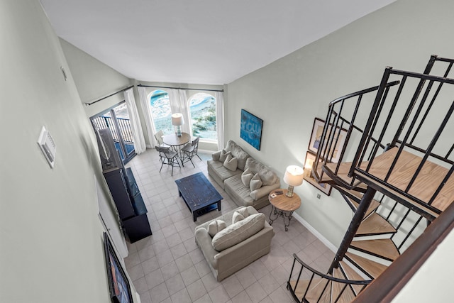 tiled living room featuring vaulted ceiling