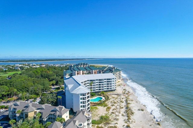 drone / aerial view with a water view and a beach view