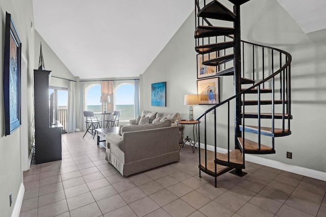 9002 Palmetto Dr Unit 512, Isle Of Palms, SC 29451 - tiled living area with stairway, baseboards, and lofted ceiling