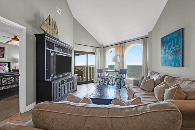 9002 Palmetto Dr Unit 512, Isle Of Palms, SC 29451 - living room featuring tile patterned floors, high vaulted ceiling, baseboards, and ceiling fan