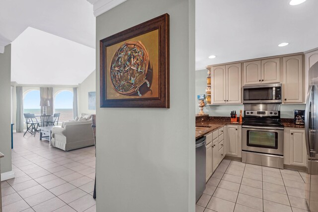 9002 Palmetto Dr Unit 512, Isle Of Palms, SC 29451 - kitchen with stainless steel appliances, light tile patterned floors, recessed lighting, dark stone counters, and open shelves
