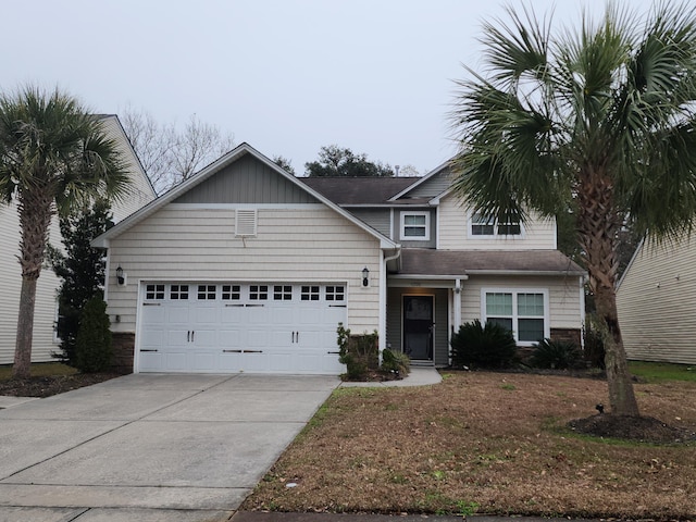 traditional-style home with concrete driveway and an attached garage