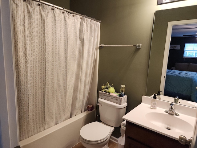 full bathroom featuring shower / bath combo with shower curtain, vanity, toilet, and connected bathroom