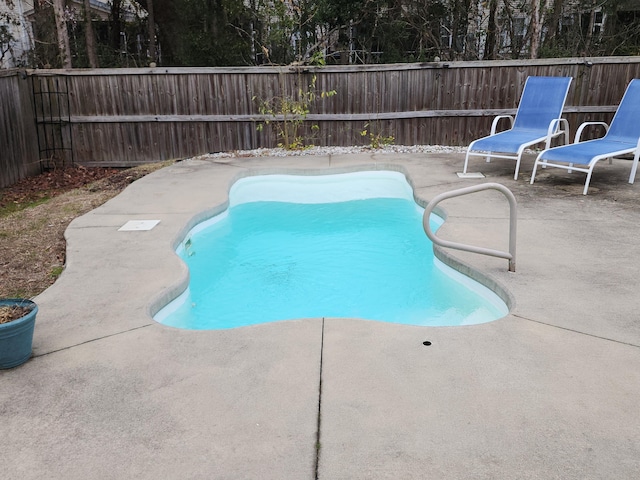 view of swimming pool with a patio, a fenced backyard, and a fenced in pool