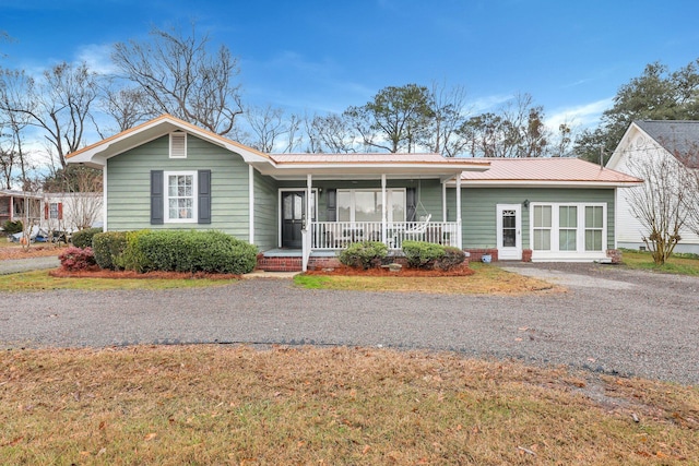 ranch-style home featuring a porch