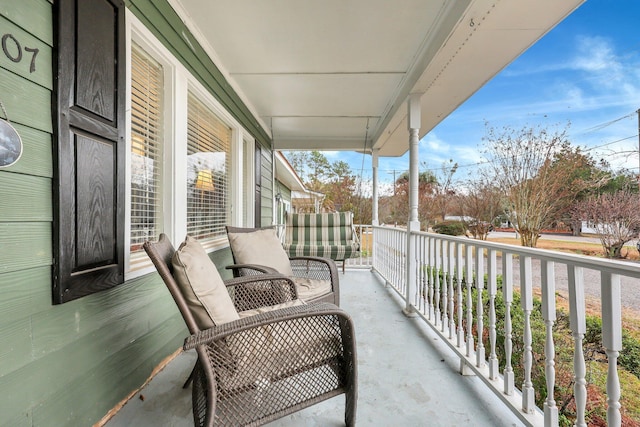 balcony featuring covered porch