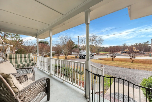 balcony featuring a porch