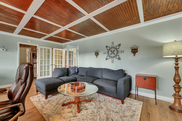 living room featuring light wood-type flooring, wood ceiling, ornamental molding, and french doors