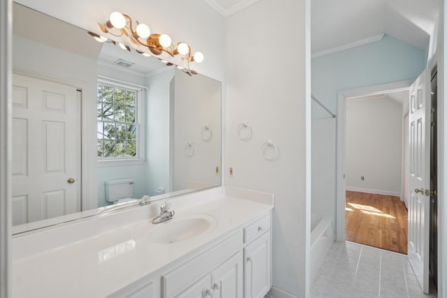 bathroom with crown molding, visible vents, toilet, vaulted ceiling, and vanity