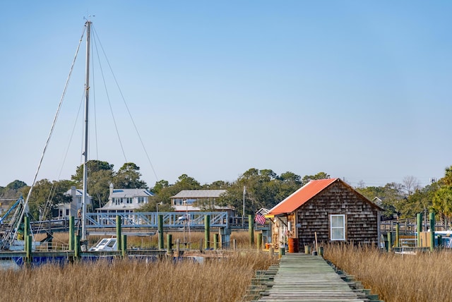 view of property's community with a dock