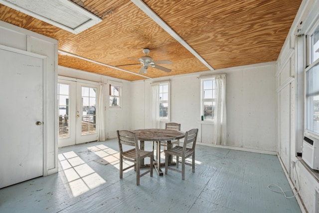 sunroom / solarium with french doors, wood ceiling, and a ceiling fan