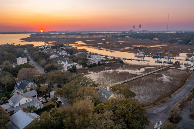 aerial view at dusk with a water view