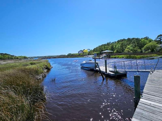 view of dock with a water view