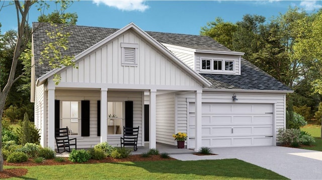 view of front of house with an attached garage, covered porch, concrete driveway, roof with shingles, and board and batten siding