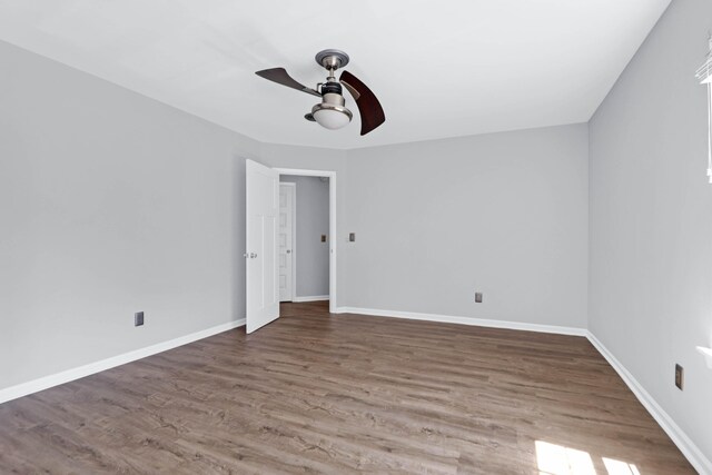 unfurnished room featuring ceiling fan and hardwood / wood-style flooring