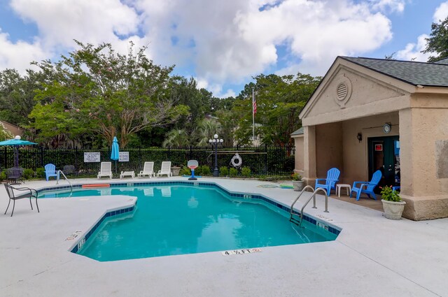 view of pool featuring a patio