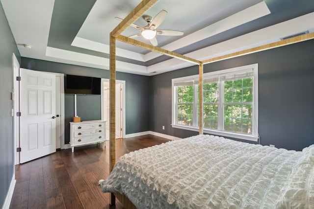5195 Forest Oaks Dr, Hollywood, SC 29449 - bedroom with a tray ceiling, baseboards, wood-type flooring, and a ceiling fan