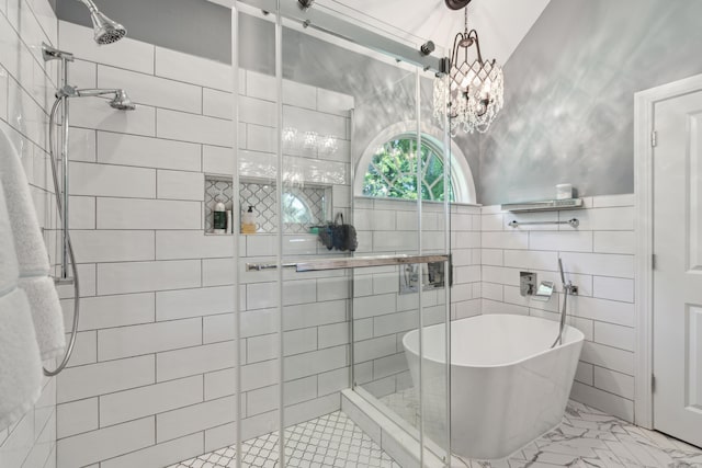 5195 Forest Oaks Dr, Hollywood, SC 29449 - bathroom with a shower stall, a freestanding tub, tile walls, marble look tiles, and a chandelier