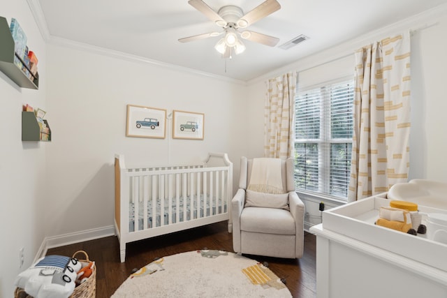 5195 Forest Oaks Dr, Hollywood, SC 29449 - bedroom featuring a crib, dark wood-style floors, crown molding, ceiling fan, and baseboards
