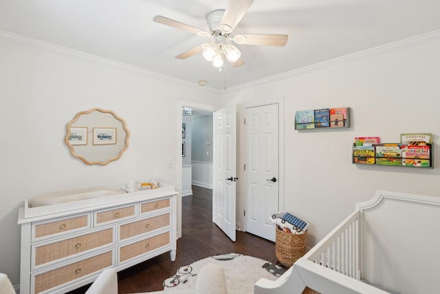 5195 Forest Oaks Dr, Hollywood, SC 29449 - bedroom featuring crown molding, dark wood-style flooring, a crib, a ceiling fan, and a closet