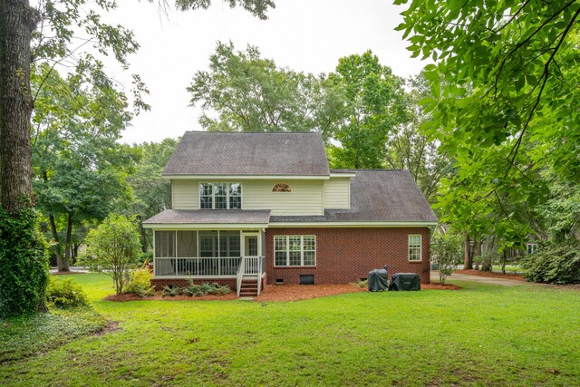 5195 Forest Oaks Dr, Hollywood, SC 29449 - rear view of property with a sunroom, a yard, brick siding, and a shingled roof