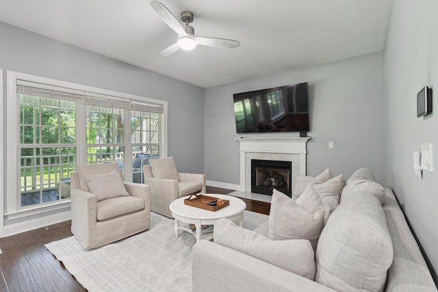 5195 Forest Oaks Dr, Hollywood, SC 29449 - living room with a high end fireplace, ceiling fan, wood finished floors, and baseboards